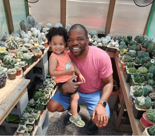 Adam Baker in greenhouse